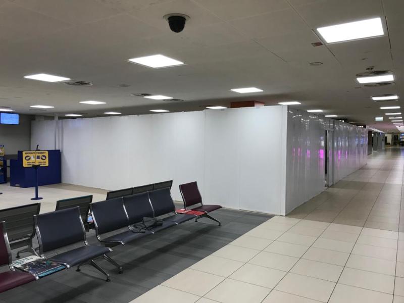 Airport Hoarding job fitted around sitting area